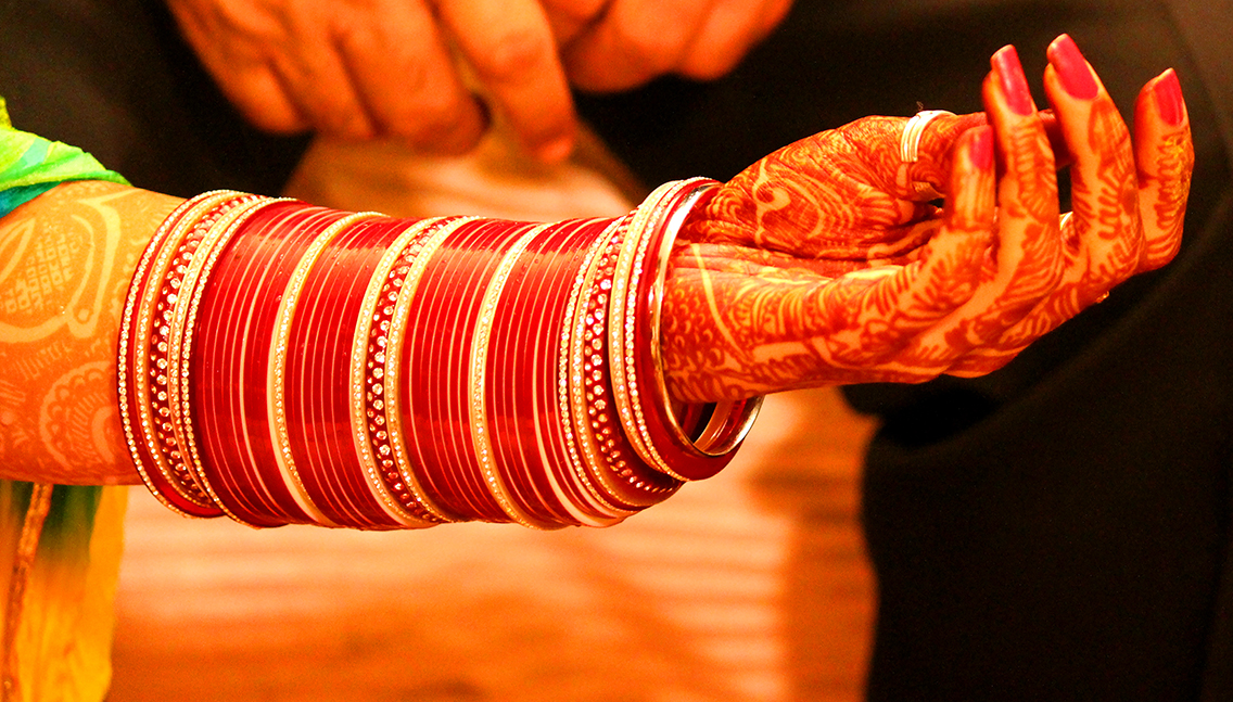 punjabi wedding couples holding hands